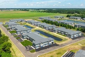 Plover apartment for rent - A large industrial complex with multiple buildings and paved areas.