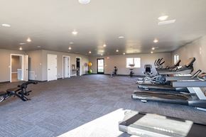 Onalaska apartment for rent - A spacious room with a row of treadmills on the right side.