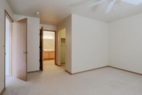 Neenah apartment for rent - an empty living room with a door to a bathroom