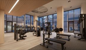 Reston apartment for rent - A gym with a variety of equipment including weights and benches.