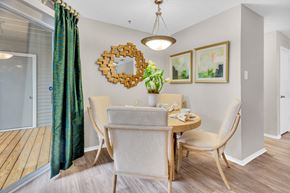 Atlanta apartment for rent - a dining room with a table and chairs and a mirror on the wall at Madison Brookhaven, Atlanta, GA, 30329