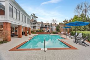 Atlanta apartment for rent - the preserve at ballantyne commons pool and patio with umbrellas at Madison Brookhaven, Atlanta, GA, 30329