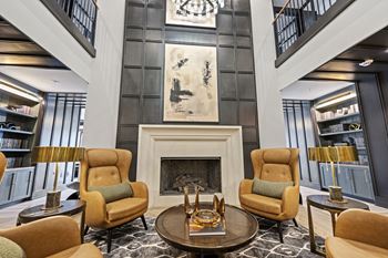 A living room filled with furniture and a fire place