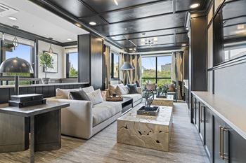 A living room filled with furniture and a large window