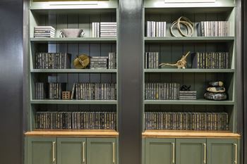 A bookshelf with books and other items on it