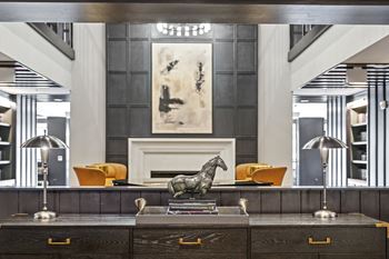 A reception desk with a bronze horse statue on top of it