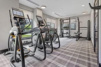 The gym at the enclave at woodbridge apartments in sugar land, tx