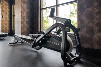 A black and white exercise bike with the word matrix on it