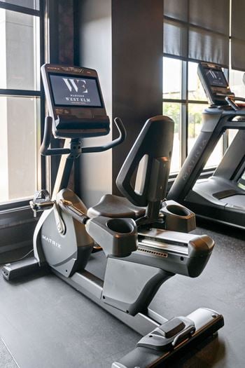 A treadmill with a digital display showing the word