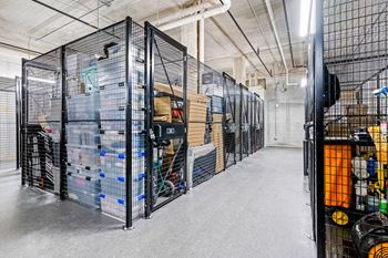 The inside of a warehouse filled with cages and boxes