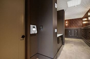 A view of a hallway with a door to a wine cellar
