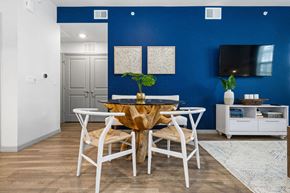 Naples apartment for rent - a dining room with a table and chairs and a tv at Inspira, Naples, Florida