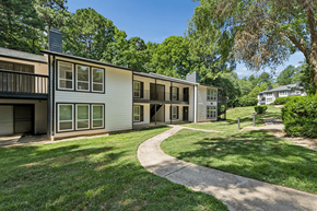 Raleigh apartment for rent - Apartment complex with a walkway in front.