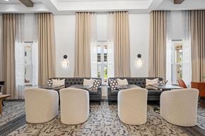 Yardley apartment for rent - a lobby with chairs and tables and a geometric pattern on the wall at Madison Prickett Preserve, Yardley, 19067
