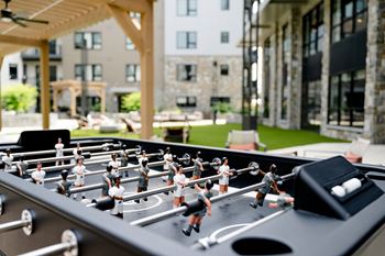 A foosball table in the common area of the residences at omni louisville