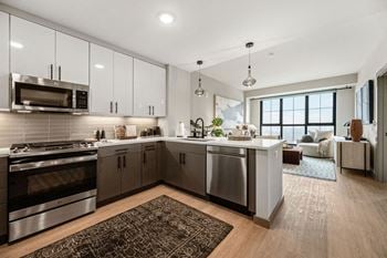 A kitchen with stainless steel appliances and a counter top