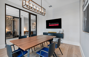 Orlando apartment for rent - a dining room with a wooden table and blue chairs at Madison Waterford Lakes, Orlando, FL