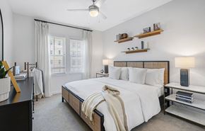Orlando apartment for rent - a bedroom with a bed and a window at Madison Waterford Lakes, Orlando, FL, 32826