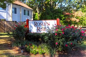 Columbia apartment for rent - a sign for roselyn rise in front of a house
