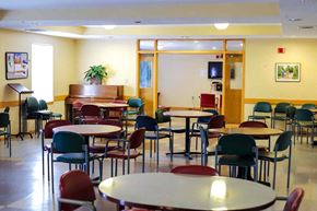 Baltimore apartment for rent - Vibrant community room at Park Heights Place hosting senior activities like bingo and movie nights for residents age 62+.