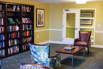 Bladensburg apartment for rent - a living room filled with furniture and a book shelf