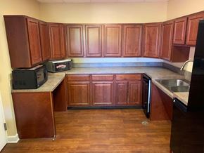 Columbia apartment for rent - an empty kitchen with wooden cabinets and a sink