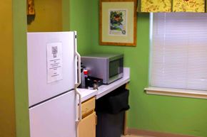 Bel Air apartment for rent - a kitchen with a refrigerator and a microwave on a counter