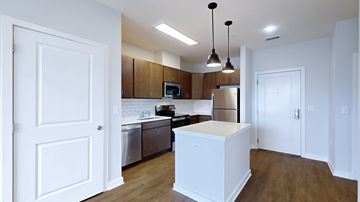 Columbia apartment for rent - A kitchen with white cabinets and a white island.