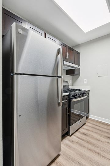 Silver Spring apartment for rent - a kitchen with stainless steel appliances and a refrigerator
