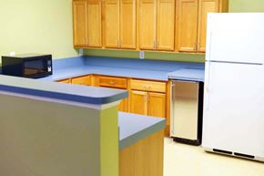 Laurel apartment for rent - a kitchen with a refrigerator and a microwave