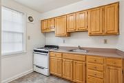 Towson apartment for rent - Kitchen at Park View at Towson with wood cabinets and modern appliances