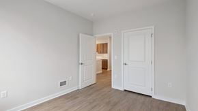 Columbia apartment for rent - A room with two white doors and a wooden floor.