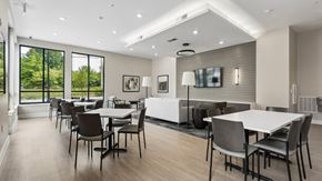 Richmond apartment for rent - A modern dining room with a large table and chairs.
