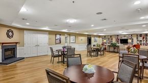 Ellicott City apartment for rent - A dining room with a fireplace and a table set for a meal.