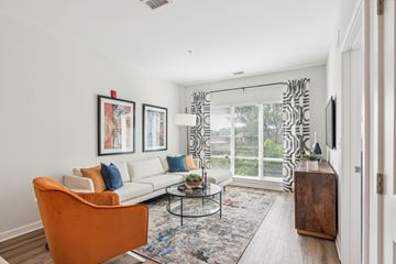 Columbia apartment for rent - a living room with a large window and a couch