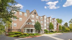 Ellicott City apartment for rent - A large apartment complex with a central courtyard and a variety of trees.