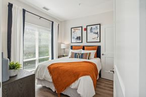 Columbia apartment for rent - Bbedroom with a bed and a large window at Legacy at Twin Rivers