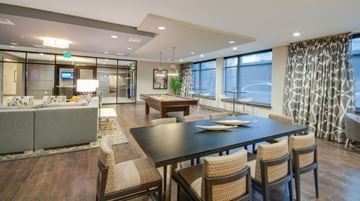 Baltimore apartment for rent - a dining room and living room with a table and chairs