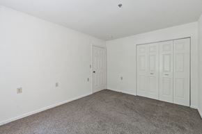 Columbia apartment for rent - a bedroom with two doors and a carpeted floor
