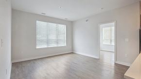 Columbia apartment for rent - A spacious room with a window and a door.
