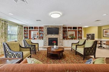Laurel apartment for rent - a living room filled with furniture and a fire place