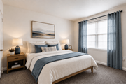 Towson apartment for rent - A bedroom with a large bed and a painting on the wall.