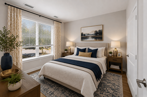 Columbia apartment for rent - A bedroom with a large bed and a view of the outdoors through the window.