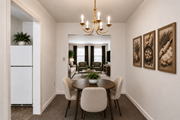Towson apartment for rent - A dining room with a table set for four.