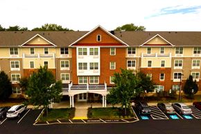Severna Park apartment for rent - an aerial view of an apartment building with a parking lot
