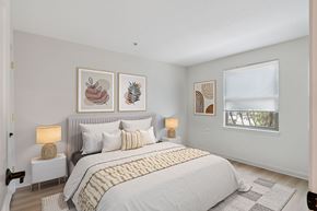 Baltimore apartment for rent - A bedroom with a large bed and a window.