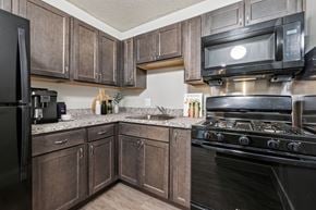 Washington apartment for rent - Modern kitchen in a 2-bedroom apartment at Edgewood Commons 611 & Gardens, showcasing energy-efficient appliances, ample cabinet storage, and sleek finishes—offering both style and functionality for everyday living.