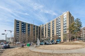 Washington apartment for rent - Exterior view of Edgewood Commons 611 & Gardens, a modern high-rise and garden-style apartment community in Northeast Washington, D.C., offering market-rate 1- and 2-bedroom homes. The building features landscaped grounds, convenient access to public transportation, and a welcoming atmosphere near Rhode Island and Brookland Metro stations.