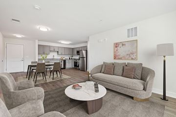 La Plata apartment for rent - A living room with a grey couch and a coffee table.