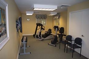 Middle River apartment for rent - A fitness room fully equipped with a treadmill, exercise bike, and a television.